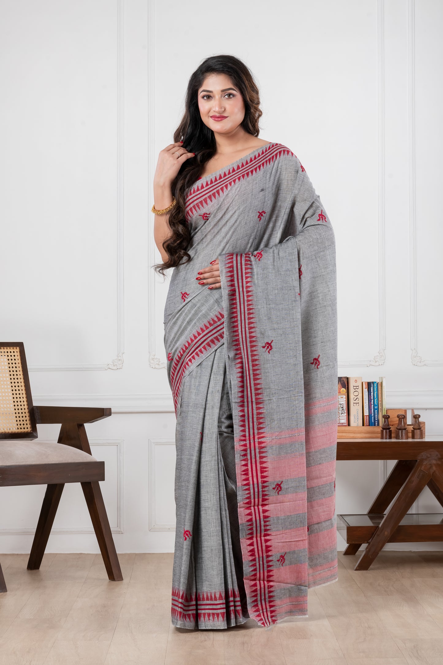 Woman wearing a gray saree