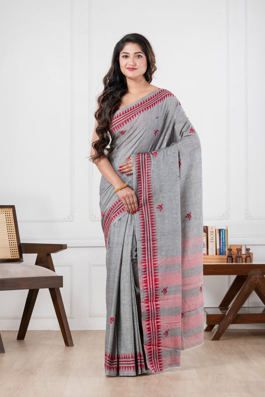 Woman wearing a gray saree