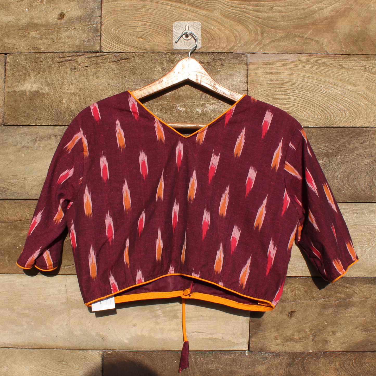 Maroon  ikkat Patterned Blouse with White Collar and Orange Accents