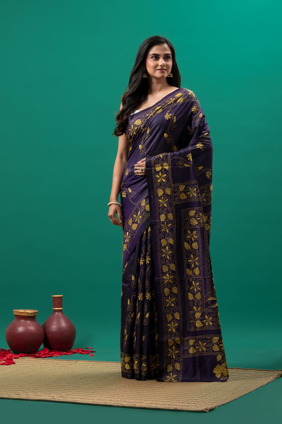 Purple kantha stitch saree and yellow flower motif