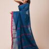 A deep blue khadi cotton saree with red and gold zari border and embroidered motifs.