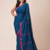 A deep blue khadi cotton saree with red and gold zari border and embroidered motifs.