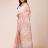 Peach semi organza saree with hand embroidery, floral motifs, silver zari border, and beaded embellishments